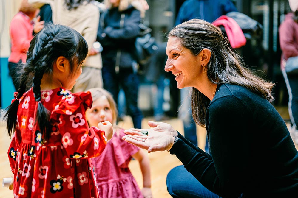 Woman speaking with children